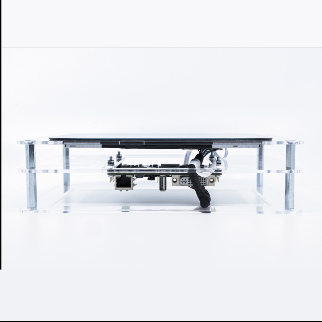 Photography by Hugo Landais, custom electronics in a clear acrylic chassis, studio product shot.