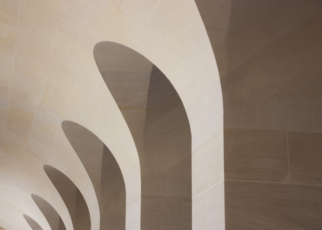 Photography by Hugo Landais, repeating stone arches.